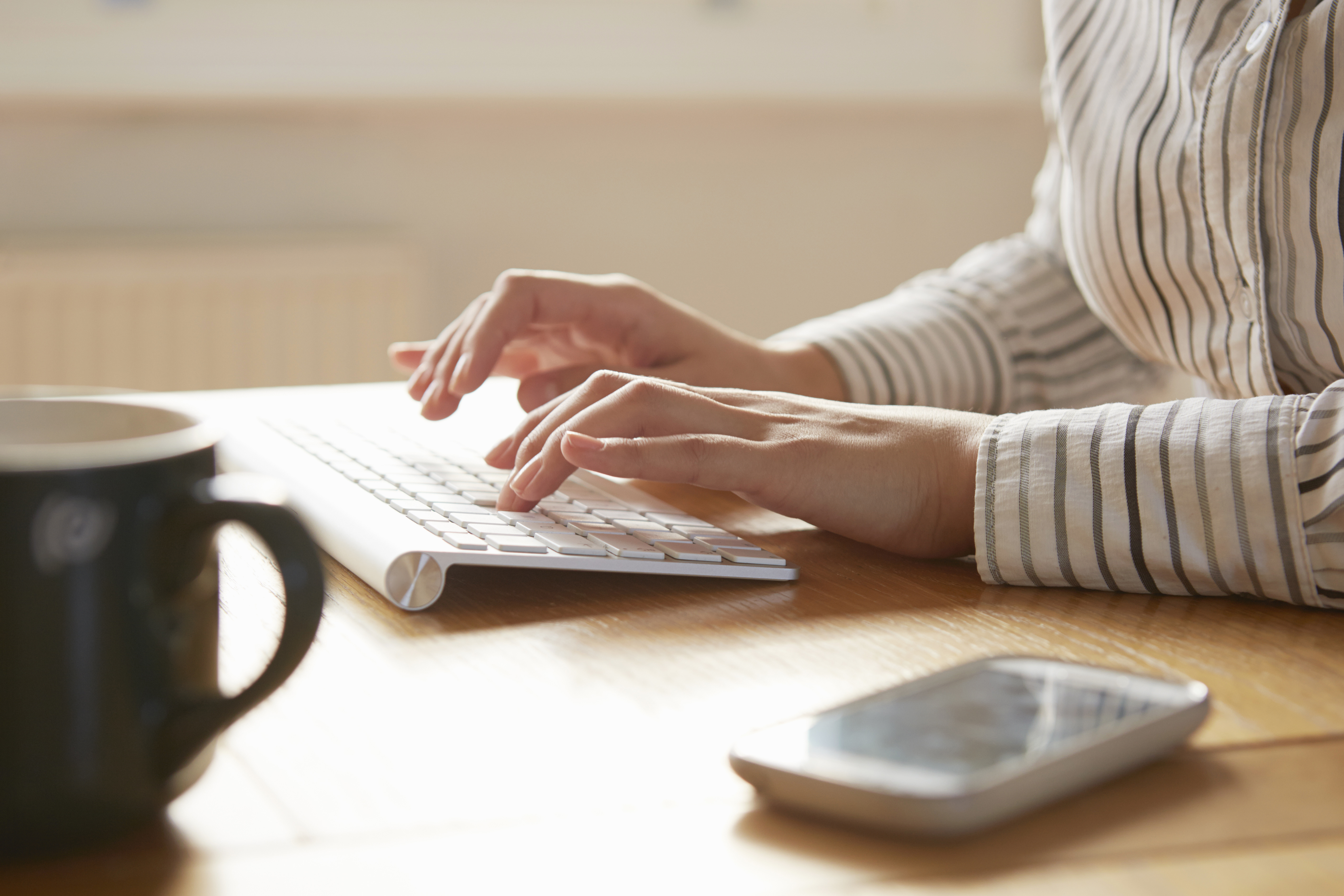 cropped-image-of-woman-typing-on-wireless-keyboard-2023-11-27-05-15-28-utc